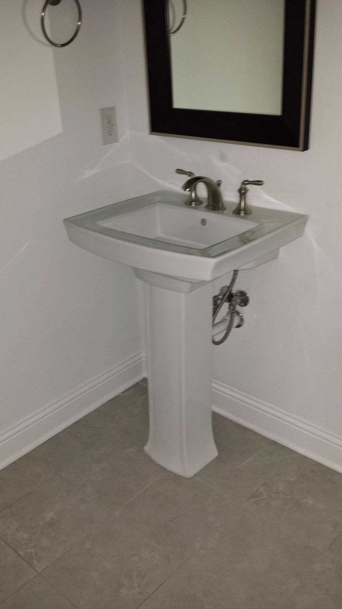 Freestanding sink installed in a bathroom