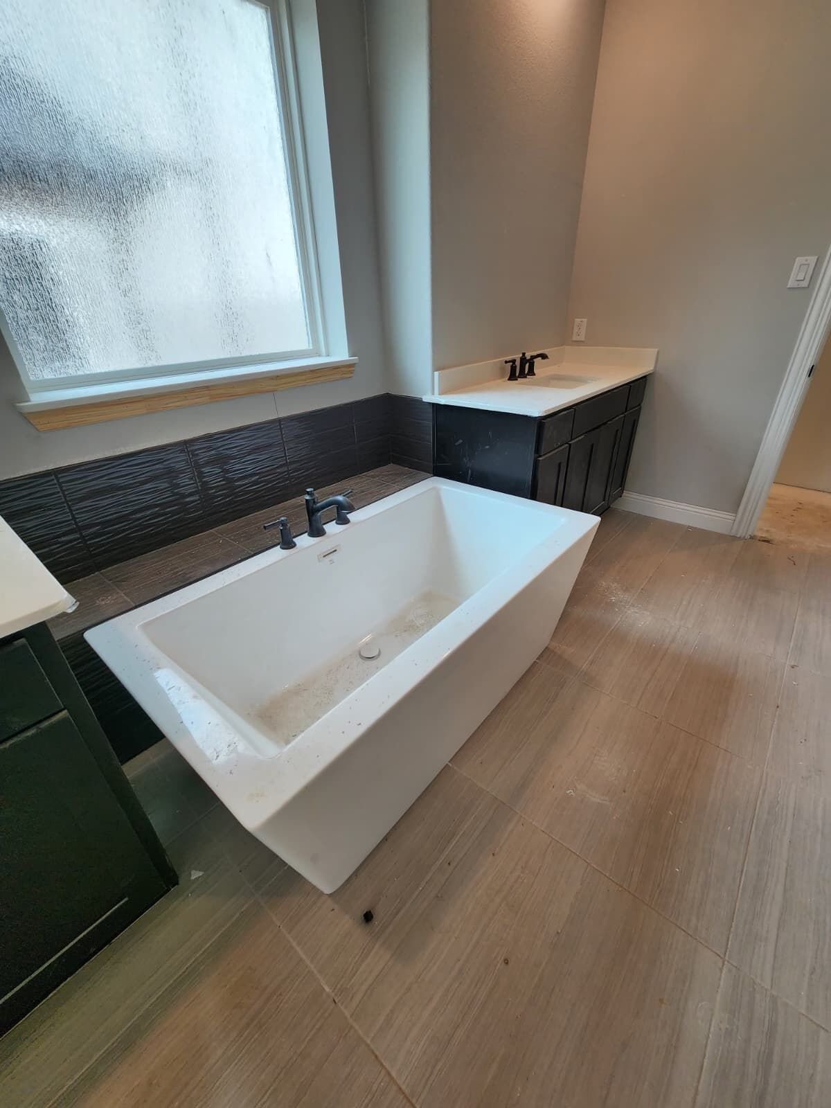 Freestanding tub installed in a residential bathroom