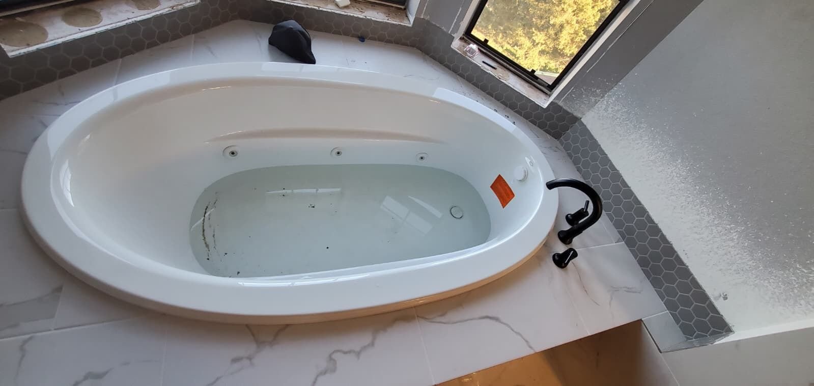 Tub installation during a fixture upgrade