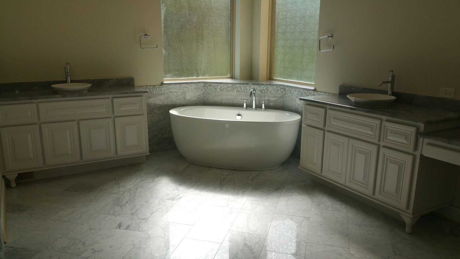 Freestanding tub installed in a finished bathroom