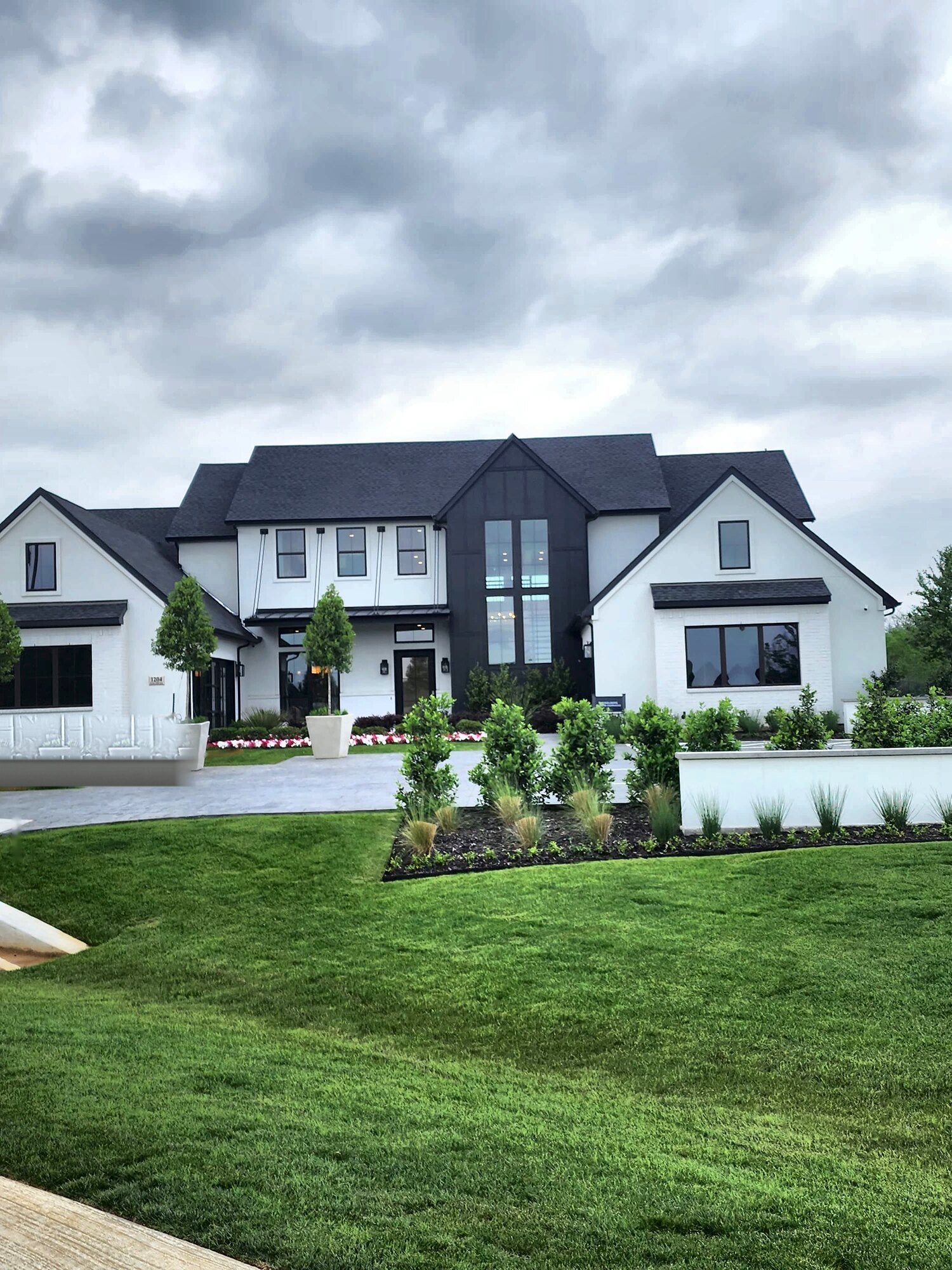 Completed model home exterior with finished landscaping