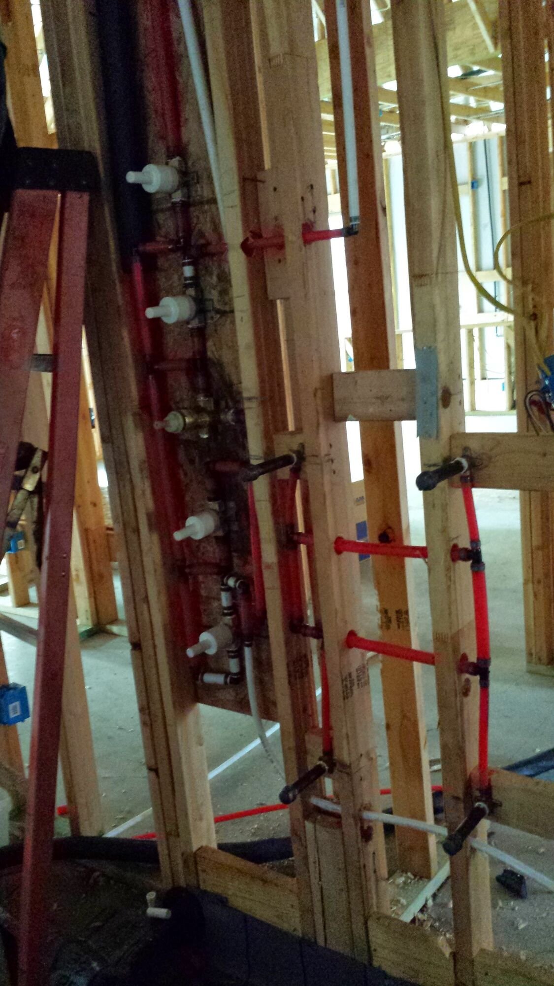 PEX water supply rough-in with copper stub-outs and test caps
