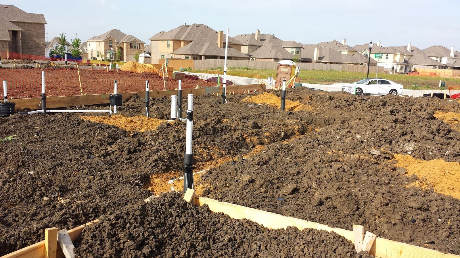 Homes under construction along a North Texas subdivision street