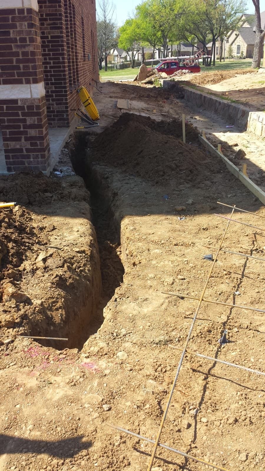 Underground plumbing trenching before pipe installation