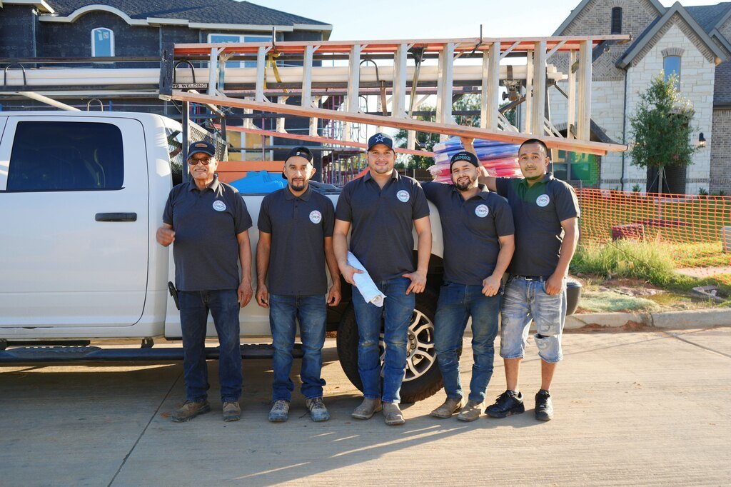 Medina Cuba Plumbing crew in front of a work truck on a DFW jobsite